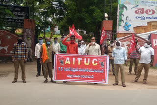 hamali workers protest in front of collectorate adilabad