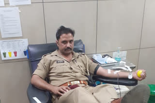 inspector donateing blood