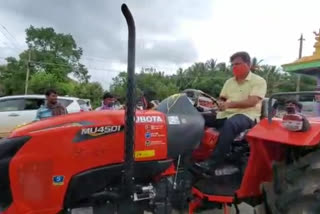 M. P. Renukaacharya driven  tractor