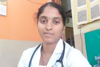 Dr. Sudhakar congratulates the Belgaum nurse