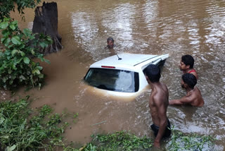 Car of forest worker in the fast flow of drain in mandla