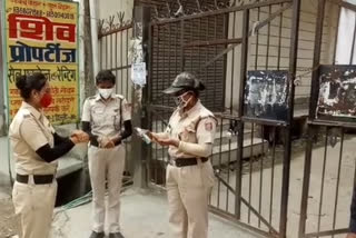 civil defence personnel doing duty at containment zone in budh vihar in delhi