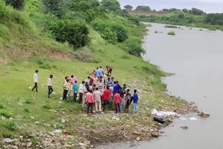 Unknown young man's body found floating in river