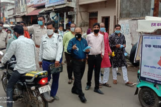 Importance of masks explained through rally in ujjain