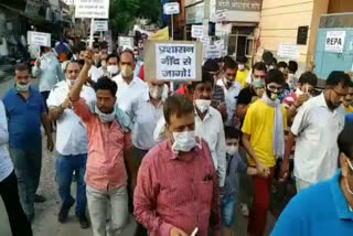 people take out candle march regarding scooty rider death in fight between two bulls rewari