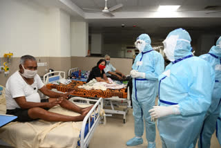 officials talking to patients