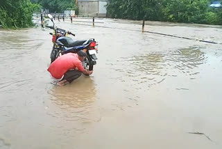 people crossing the bridge during raining