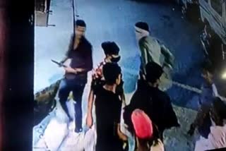 miscreants in crowd attacked youth with knife cctv footage captured at mangolpuri in delhi