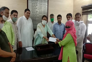 nirmal chaudhary distributed certificates to 18 families under the pm awas yojana in gannaur