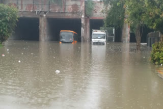 Bus and truck stranded due to heavy waterlogging under Pul Prahlad Pur railway underpass