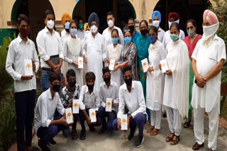 Dr. Amar Singh distributes smartphones to students in Raikot