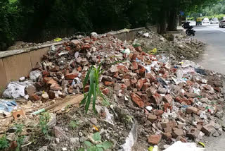 Debris spread on roads in Greater Kailash area in Delhi