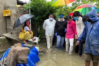 Minister inspecting submerged colonies in warangal district