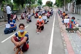 Open school students protest outside Singla's dormitory