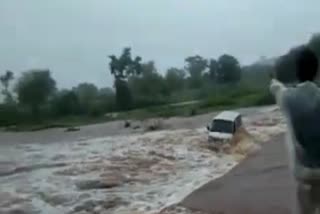 Maruti van in a booming stream