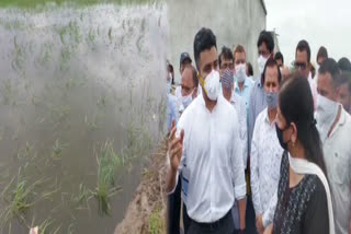 DM Rahul Singh and former SDMC leader Sadan Kamaljit Sehrawat arrived to meet farmers after waterlogging in Rawta village