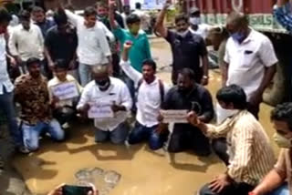 Villagers protest on their knees demanding road construction