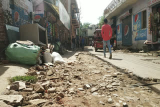 broken road and  drain in rajokri