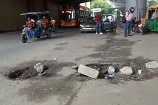 Pit on road of Jhanakpuri west metro station in Delhi