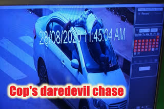 Andhra police officer's daredevil chase on car bonnet