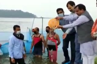 Rural Development Minister Virendra Kanwar casts silver fish in Govind Sagar Lake