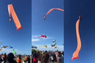 Girl swept up in the air by kite in Taiwan's festival