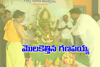 A young man made with a Ganesha idol with rice