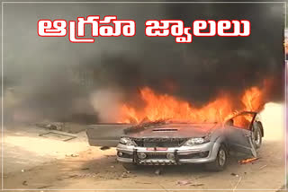 tension-at-khammam-corporator-car-fired-by-villagers