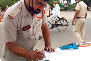 police officer smoking in public in jhajjar