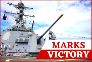 Sailors man the rails as the guided-missile destroyer USS Michael Murphy (DDG 112) passes Battleship Missouri Memorial during the official ceremony for the 75th anniversary of the Japanese surrender that ended World War II, o Wednesday in Honolulu, Hawaii.