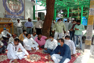 employees protest outside corporation headquarters