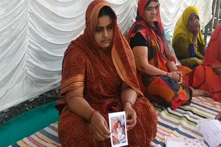 A woman sitting on a strike