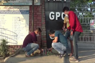 Fee case: Parents protest by lighting candles outside school