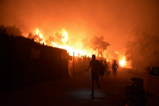 Fires at Greek migrant camp force evacuation during lockdown
