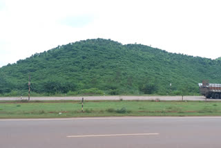 lush-green-hillside-with-constant-rain-in-hospete