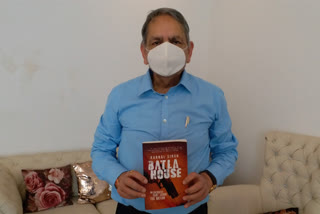 Karnail Singh with his book