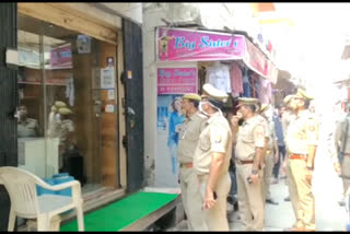 Police officials check security arrangements at jeweler shops in Dankour town