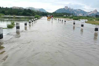 people-crossing-the-road-in-floods-with-landslides