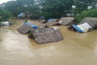 Submerged huts in the flood at duvva