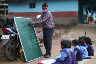 Virendra of Jashpur comes with a board in his bike to teach children