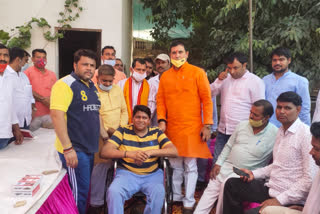 BJP MLA Nandkishore Gurjar celebrates PM birthday by distributing crutches and wheel chairs to Divyang