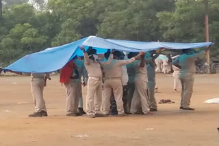 Assistant policeman forced to get wet in rain