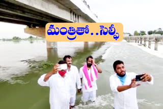 minister-srinivas-goud-spend-time-happily-in-canal-at-mahabubnagar-district
