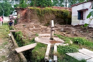 Toilets being built near hand pumps in seoni