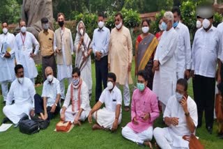 Protest by suspended MP's near Gandhi statue of Parliament