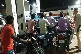 crowd of people in petrol pumps