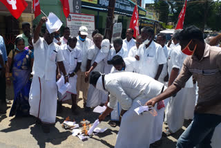 CPM party members burns modi effigy