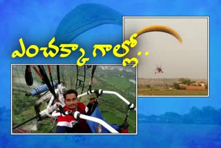 railway employee arjun paragliding in ramagindam