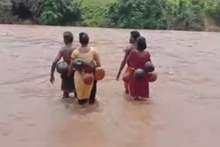 Flooded river deters not these brave Anganwadi workers