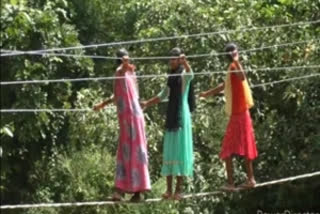 Electric wires serve as bridge to cross river in Kandhamal
